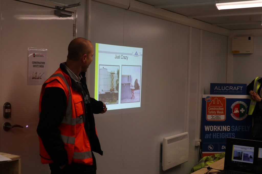 Safety instructor giving presentation to construction staff